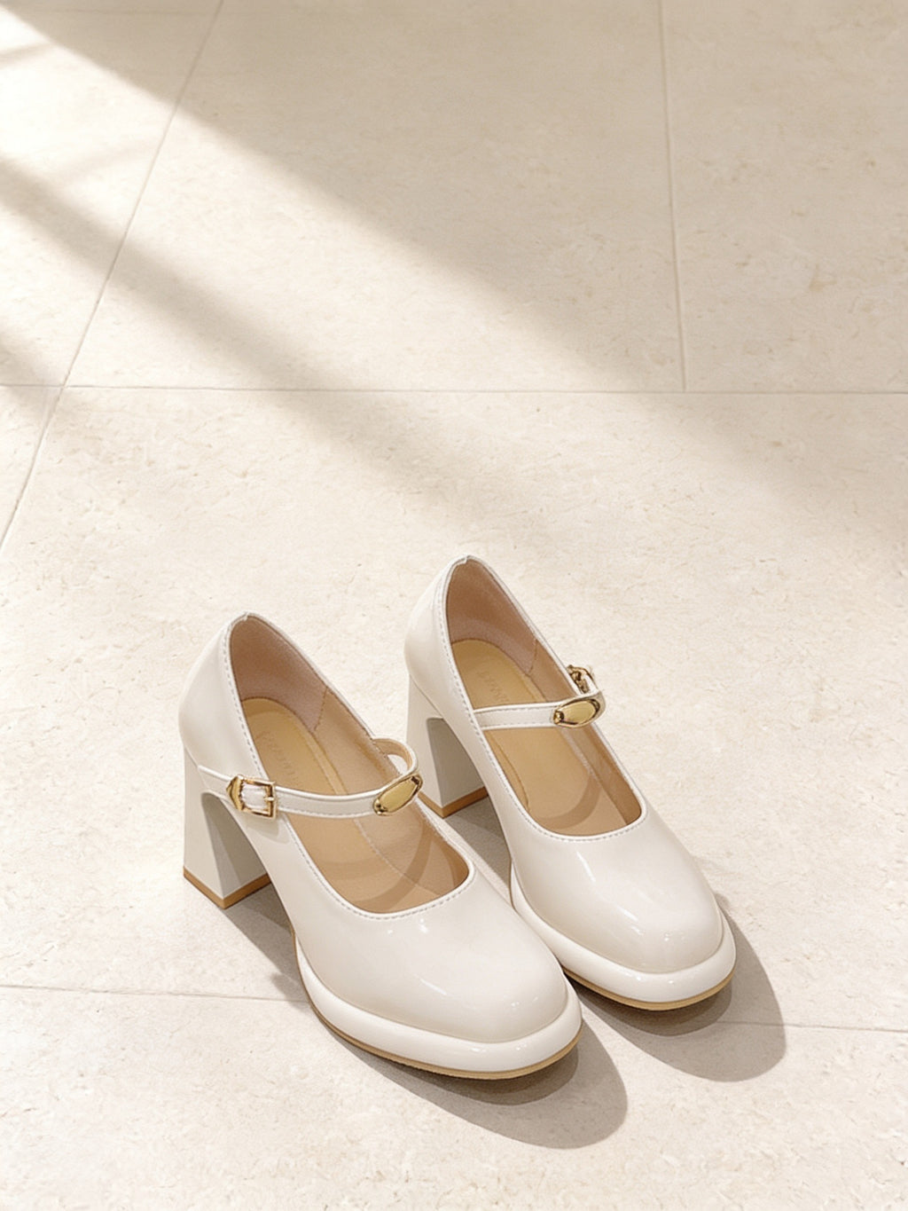 The Lobby Date Mary Jane in White, pair on pale limestone