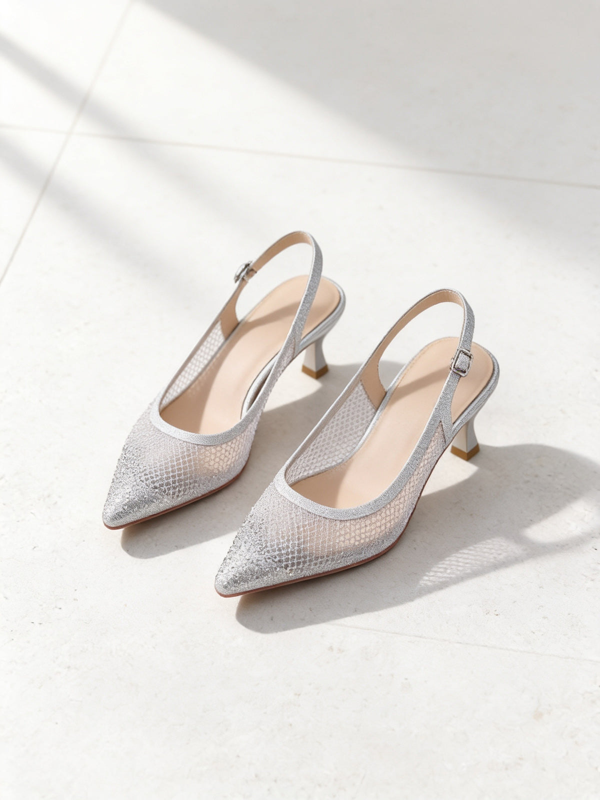 The Moonlight Slingback in Silver, pair on pale limestone