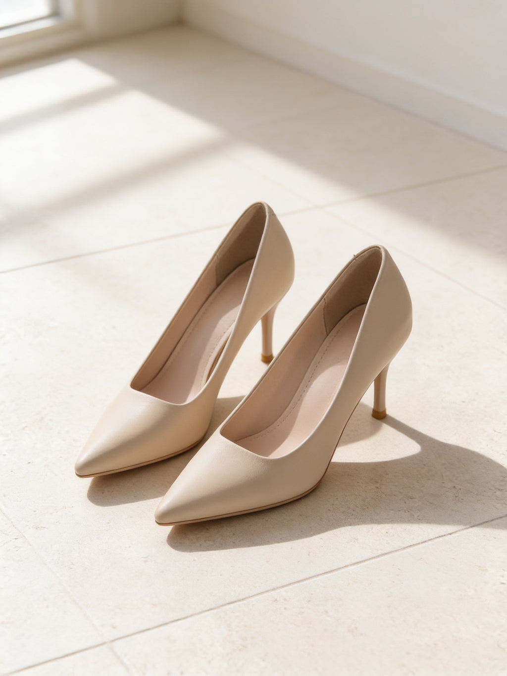 The Reservation Pump in Nude, pair on pale limestone