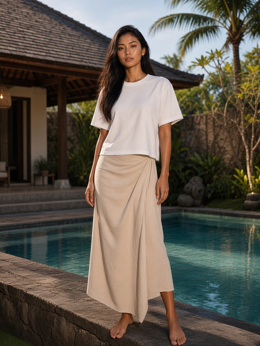 Marcel Afters Heavyweight Mineral Wash Boxy T-Shirt in White, worn by a woman, poolside