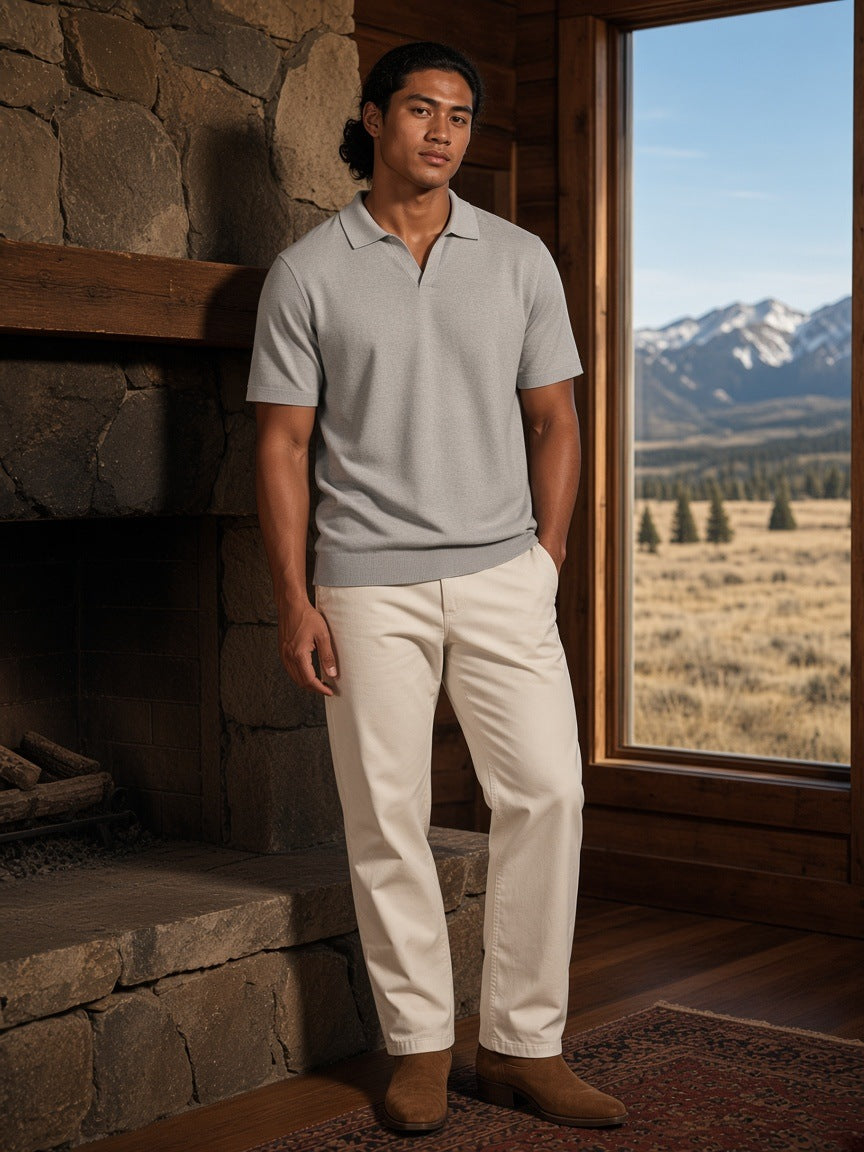 Marcel Afters Heavyweight Oversized Polo Shirt in Grey, worn by a man, wooden cabin