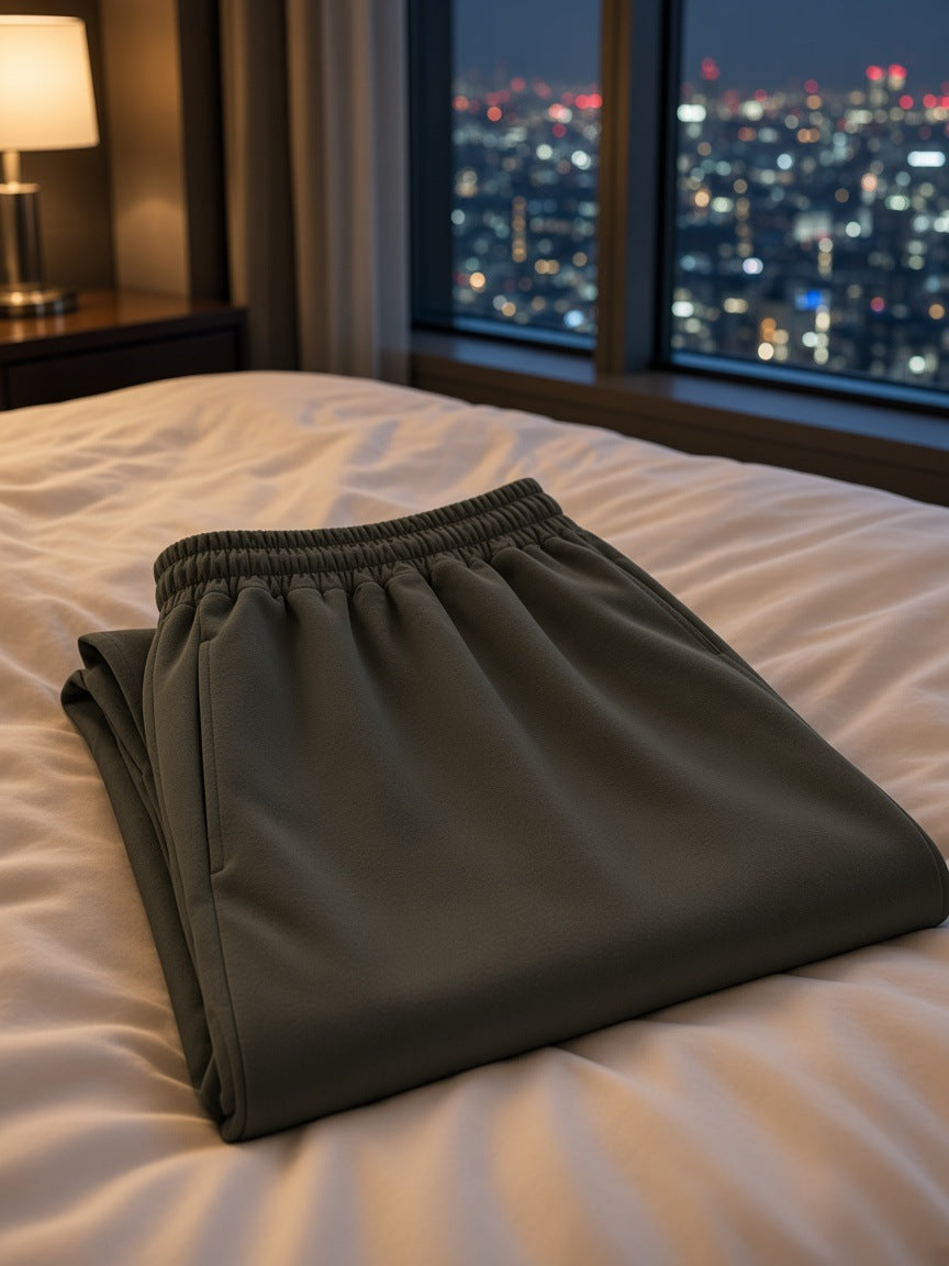 Marcel Afters Heavyweight Shorts in Blackish Green, laid flat, city at night