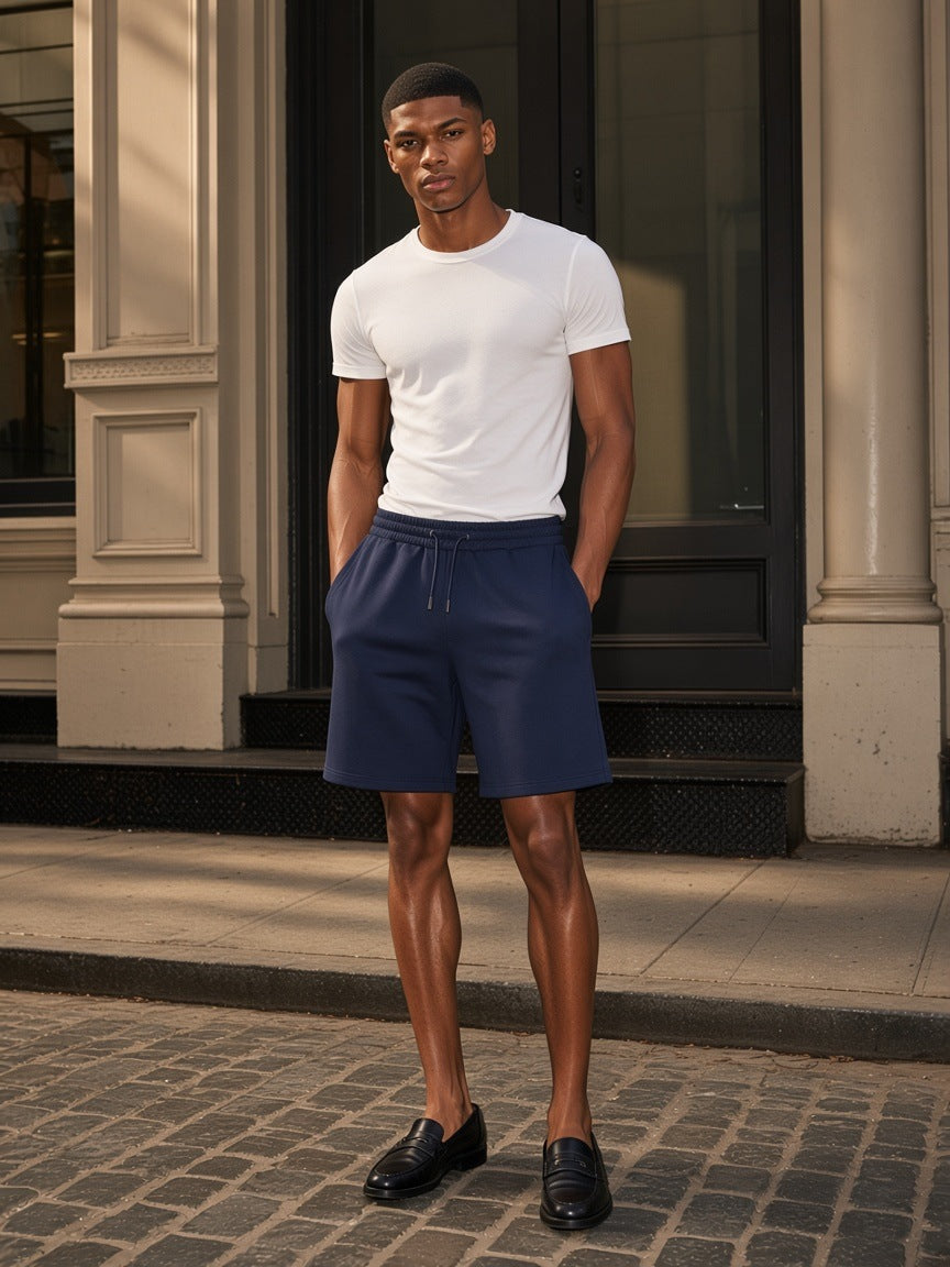 Marcel Afters Heavyweight Shorts in Navy Blue, worn by a man, city street