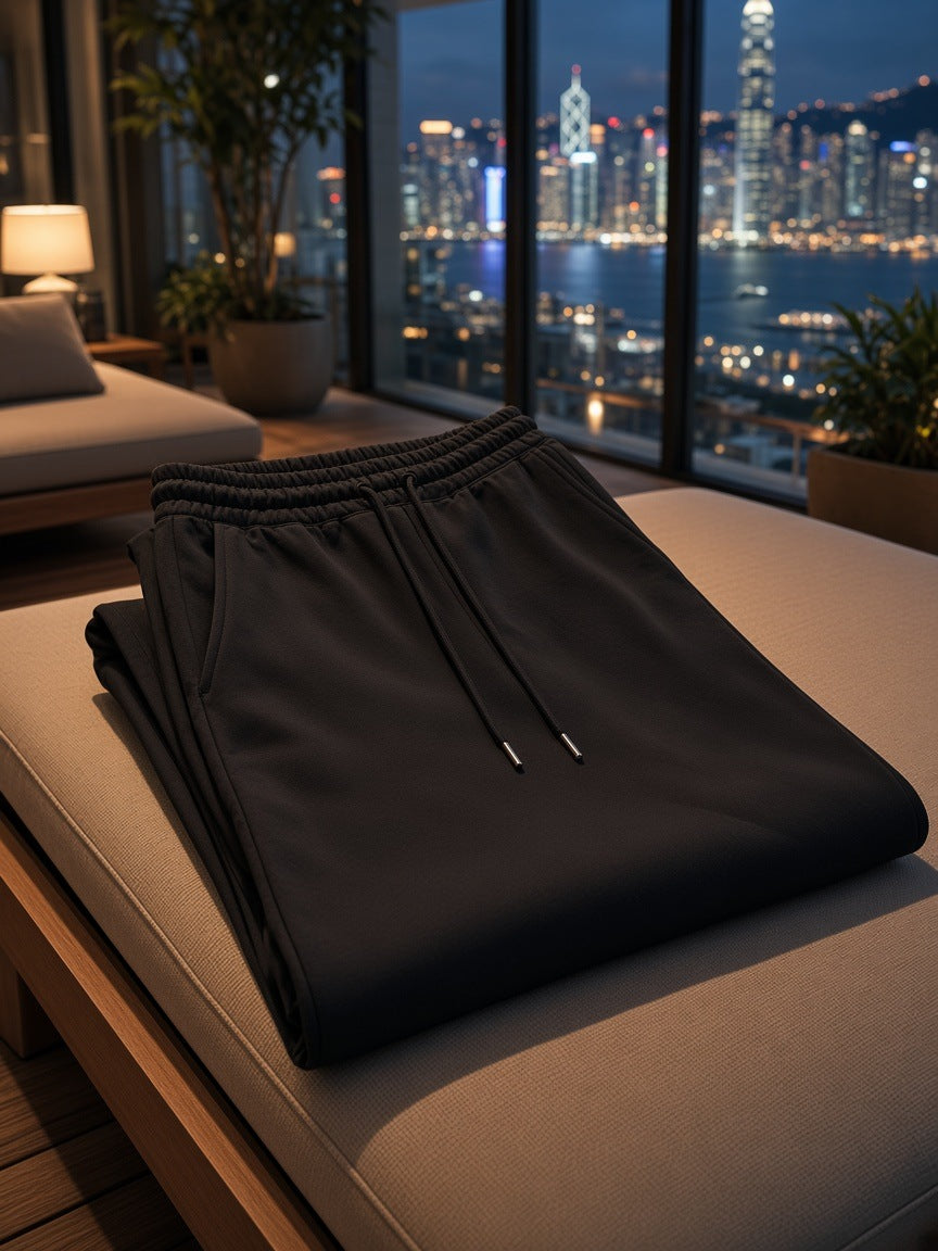 Marcel Afters Heavyweight Sweatpants in Black, laid flat, city