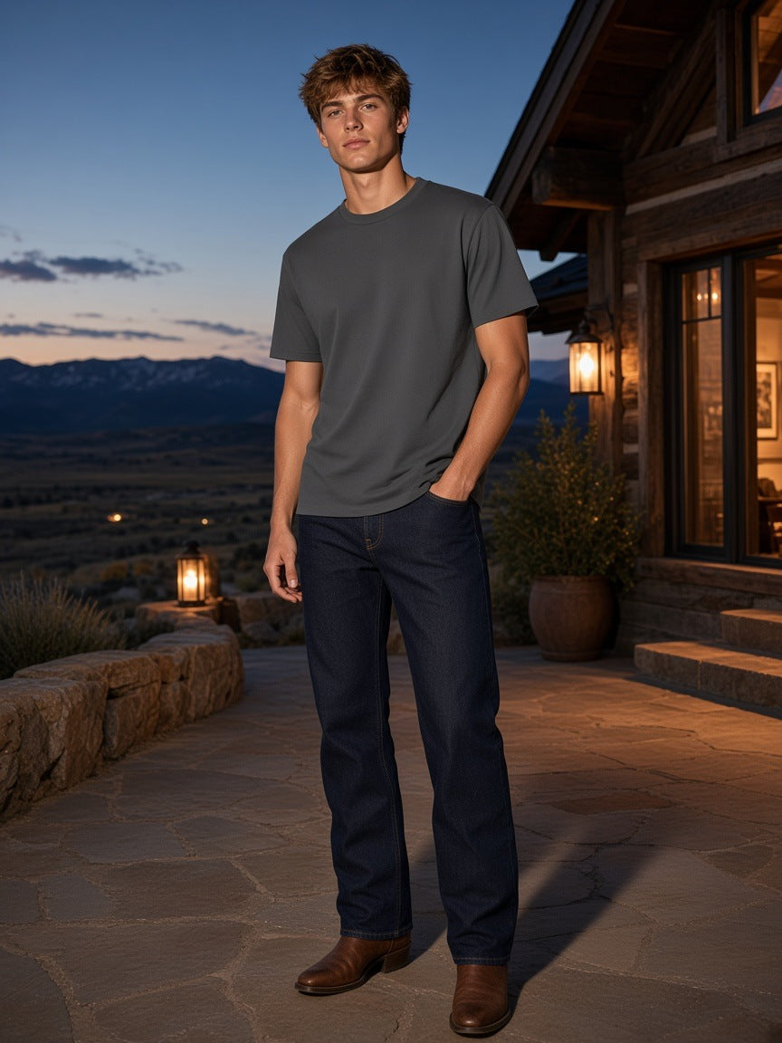 Marcel Afters Lightweight Oversized T-Shirt in Charcoal Gray, worn by a man, outdoor patio