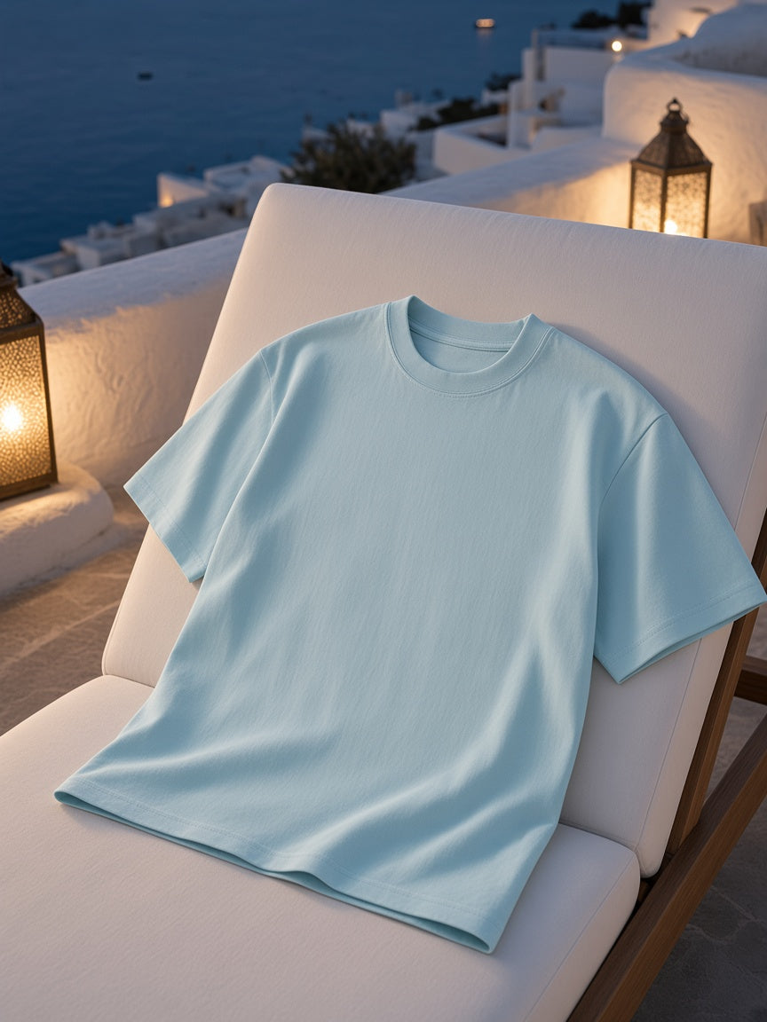 Marcel Afters Loose Drop Shoulder T-Shirt in Sky Blue, laid flat, rooftop