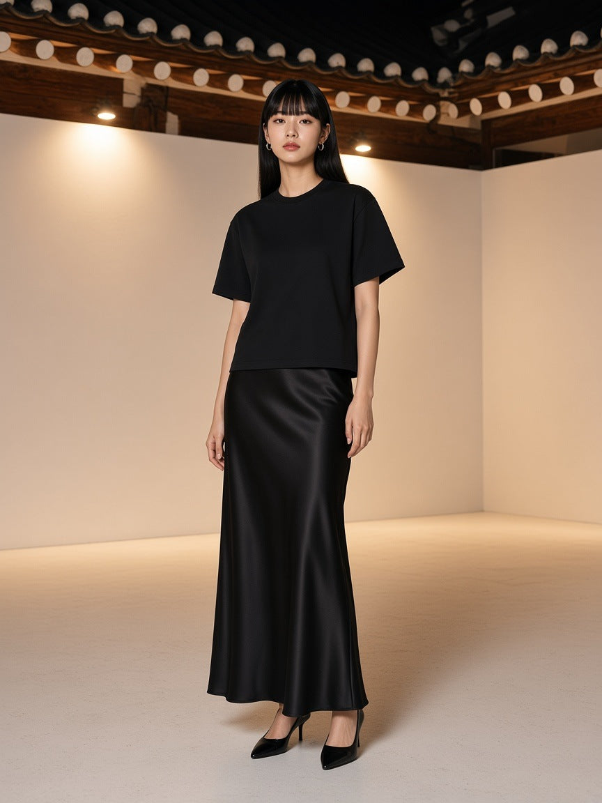 Marcel Afters Sun Fade Distressed Boxy T-Shirt in Black, worn by a woman, studio