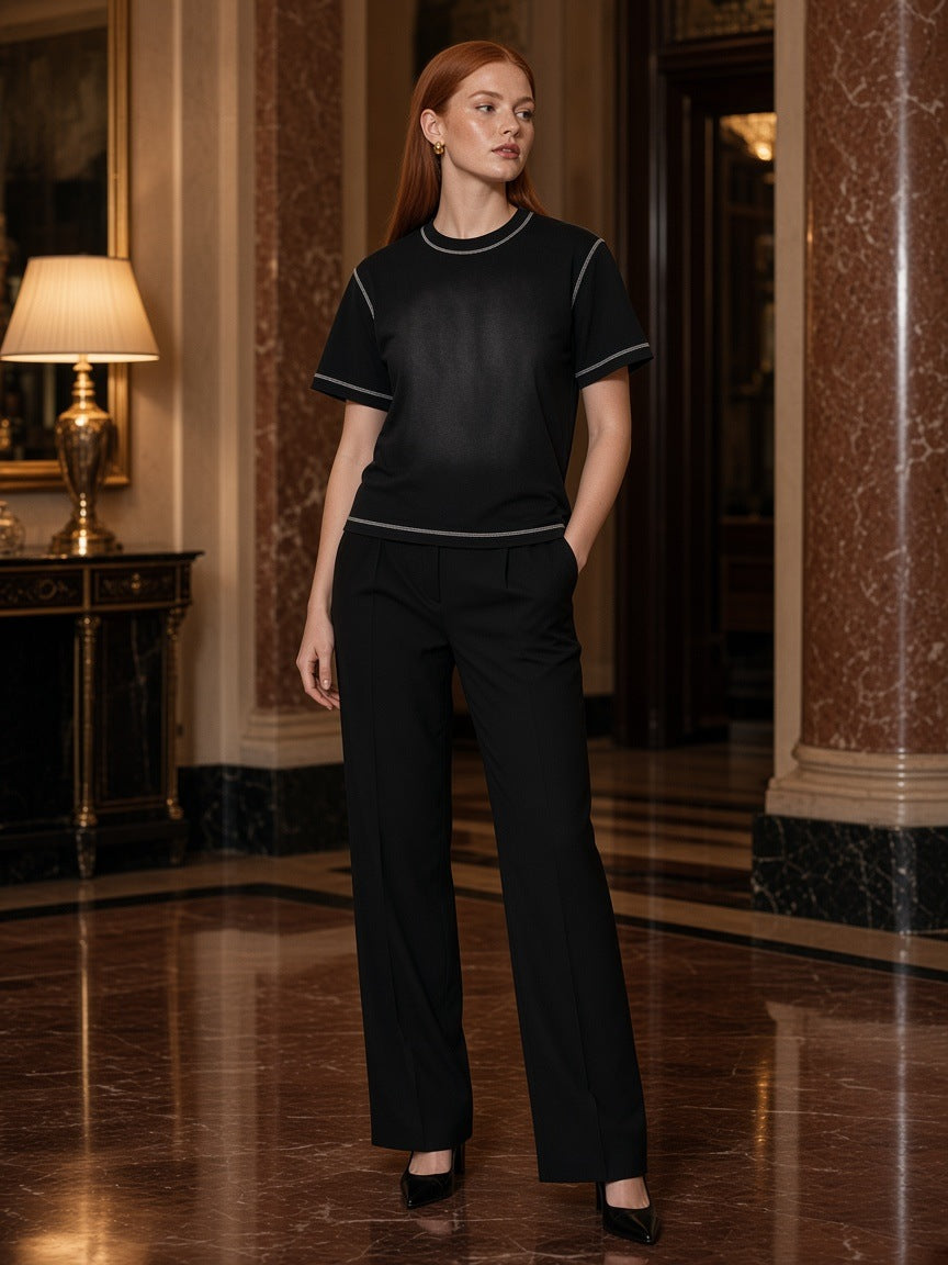 Marcel Afters Sunfade Waffle Boxy T-Shirt in Black, worn by a woman, marble