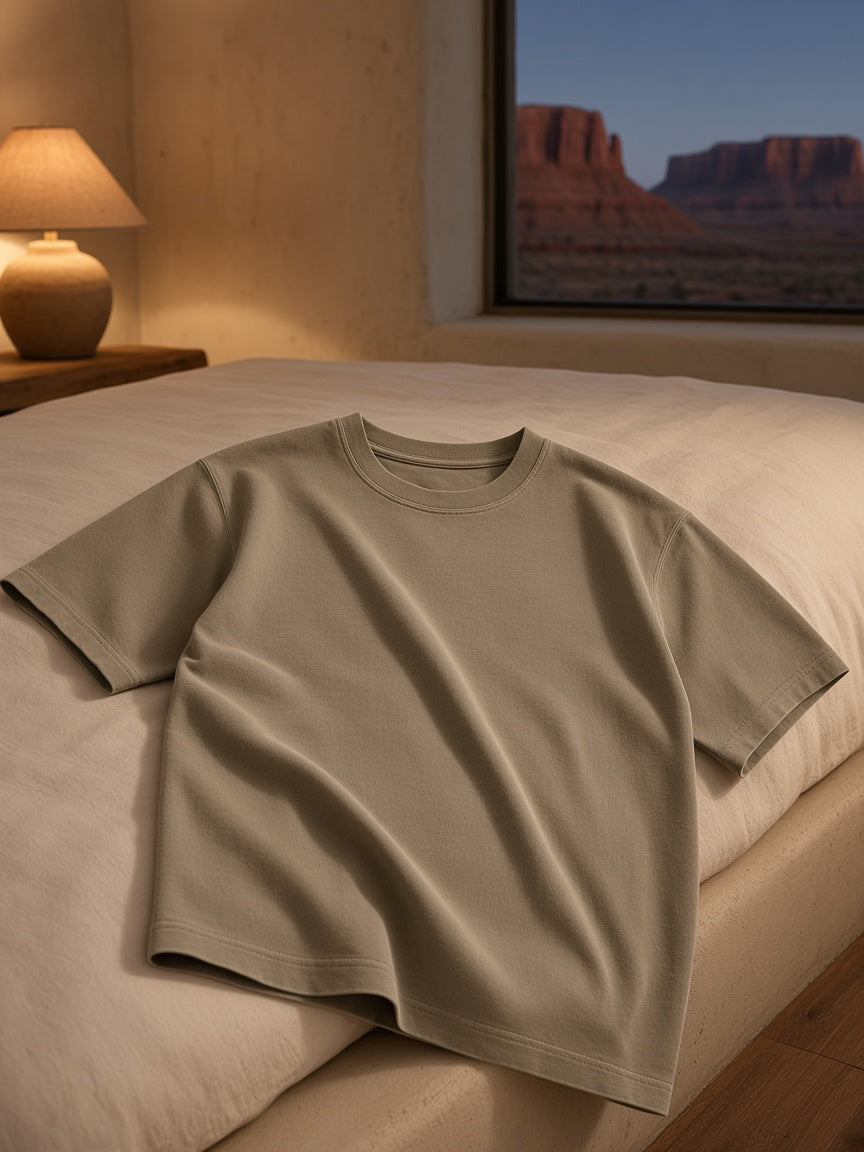 Marcel Afters Vintage Wash Boxy T-Shirt, 230 gsm in Light Coffee, laid flat, bedroom