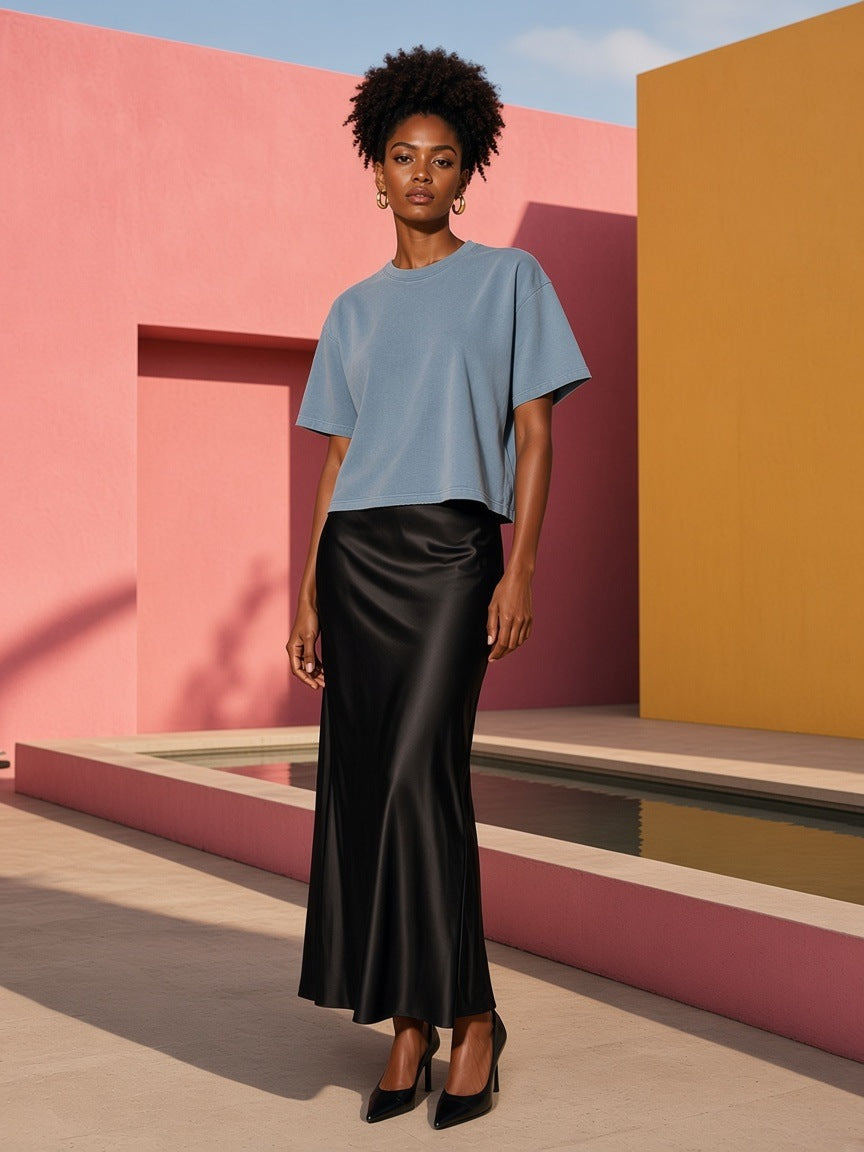 Marcel Afters Vintage Wash Boxy T-Shirt, 260 gsm in Blue, worn by a woman, pink wall