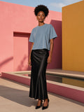 Marcel Afters Vintage Wash Boxy T-Shirt, 260 gsm in Blue, worn by a woman, pink wall