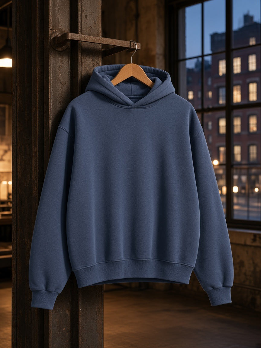 Marcel Afters Vintage Wash Boxy Fleece Hoodie in Navy Blue, on a hanger, industrial