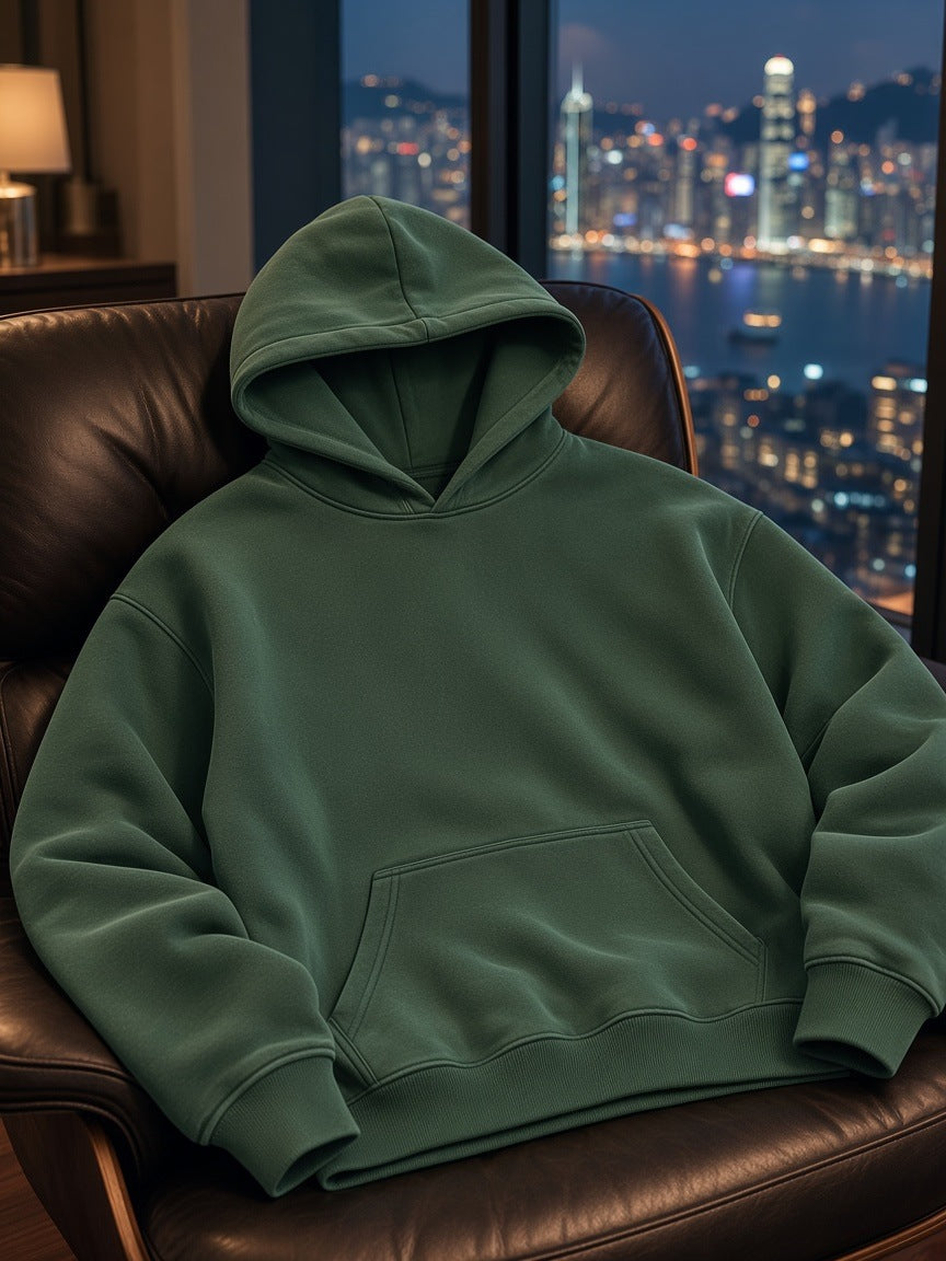 Marcel Afters Vintage Wash Boxy Fleece Hoodie in Dark Green, laid flat, city skyline