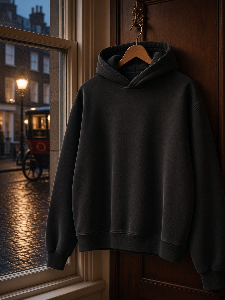 Marcel Afters Vintage Wash Boxy Fleece Hoodie in Dark Green, on a hanger, city street
