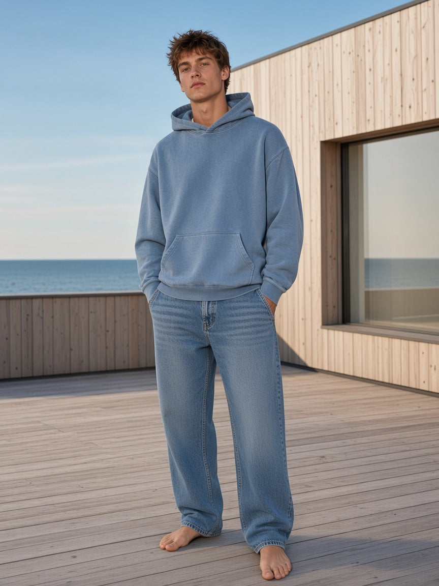 Model wearing the Vintage Wash Boxy Hoodie in Jeans Blue, full-length model photo