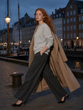 Marcel Afters Vintage Wash Crewneck Sweatshirt in Light Gray, worn by a woman, city street
