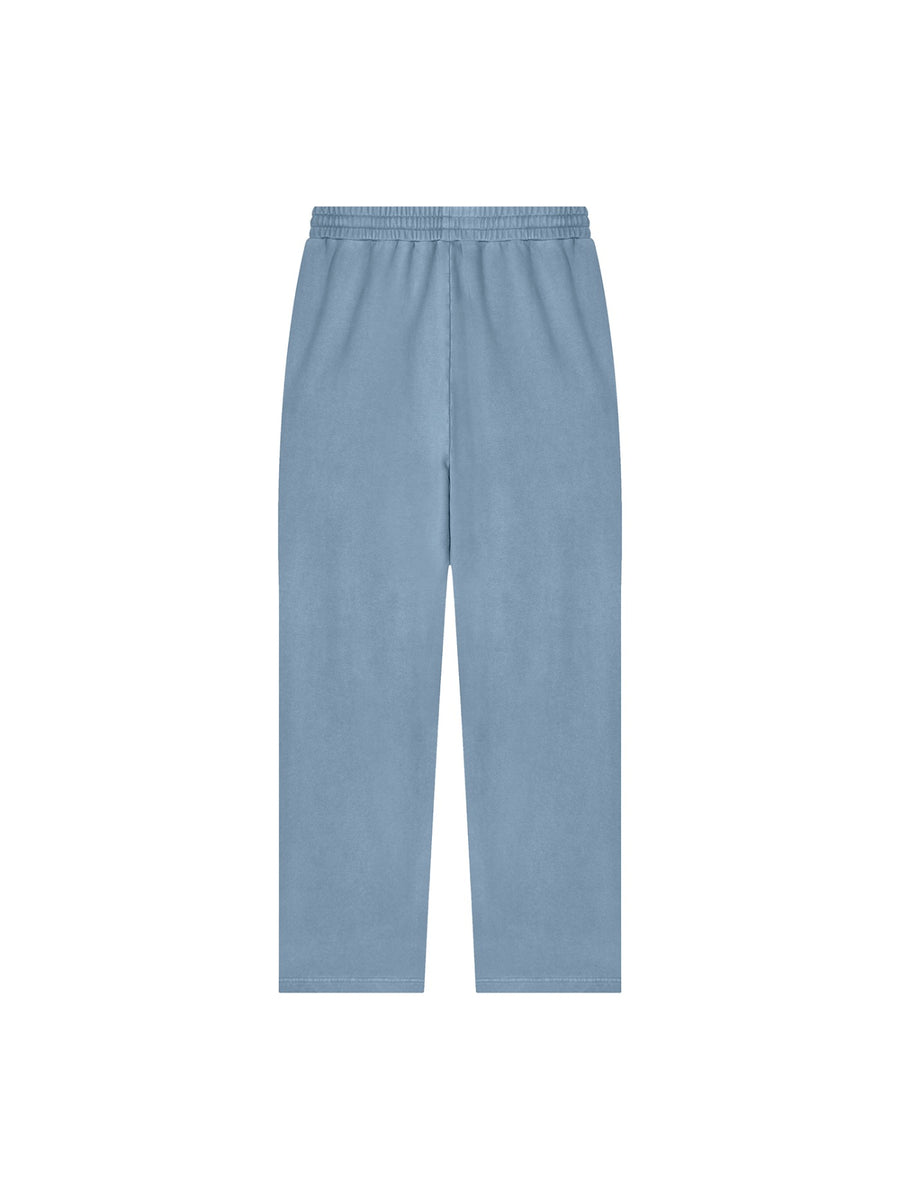 Marcel Afters Vintage Wash Sweatpants in Jeans Blue, worn by a woman, plain white background