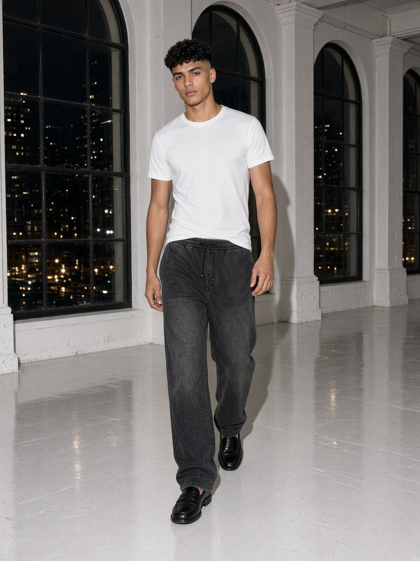 Man wearing the Vintage Wash Sweatpants in Dark Gray, full-length model photo