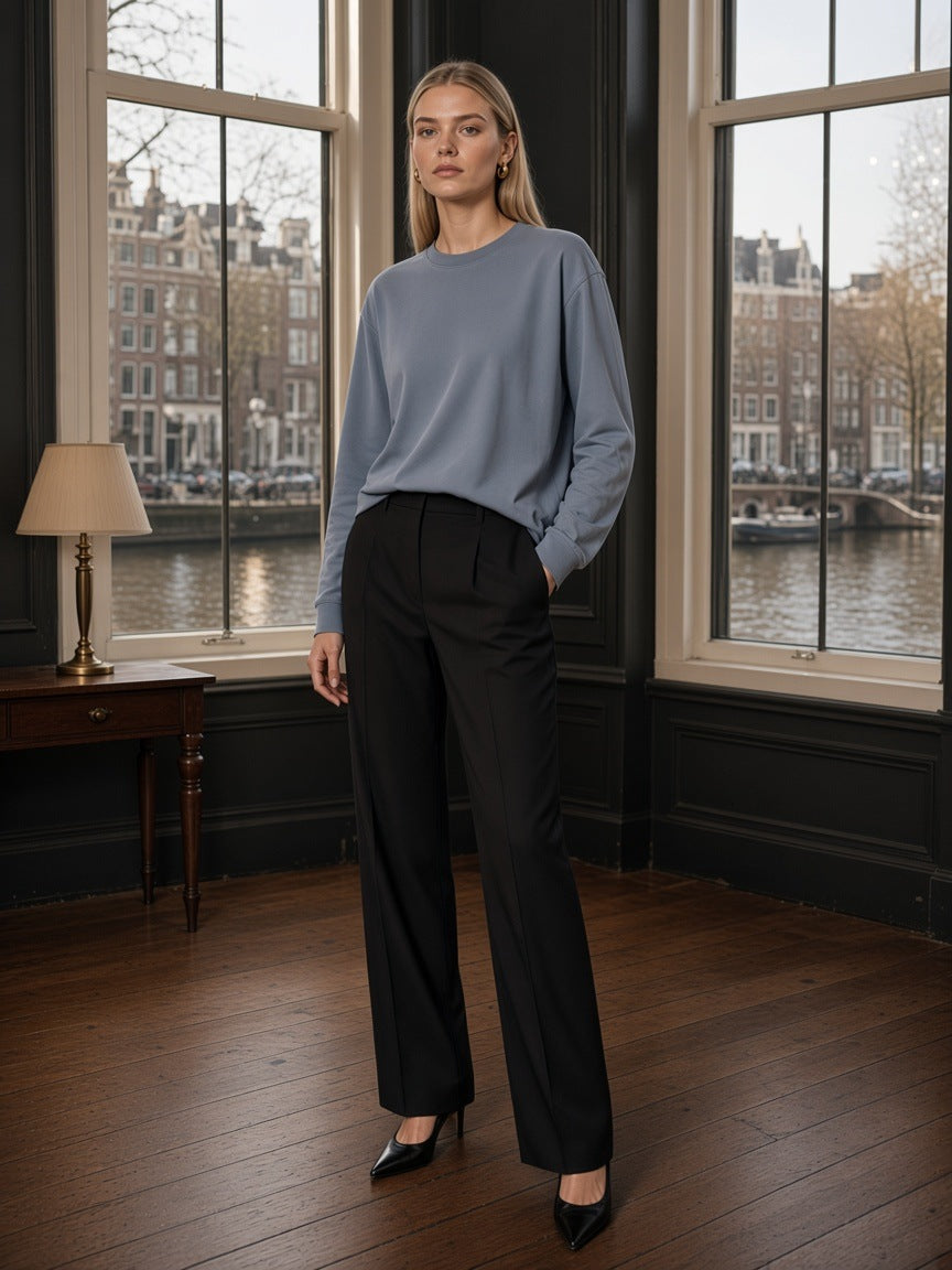 Marcel Afters Vintage Washed Long Sleeve T-Shirt in Gray Blue, worn by a woman, room