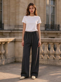 Woman wearing the Vintage Washed Waist Pants in Washed Black, full-length model photo
