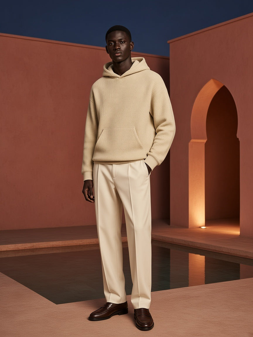 Marcel Afters Waffle Boxy Hoodie in Oat Gray, worn by a man, arched doorway