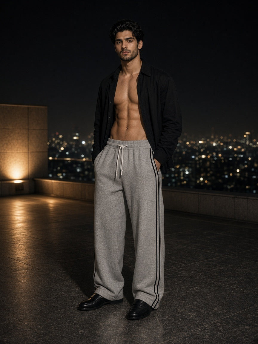 Marcel Afters Wide Leg Piping Sweatpants in Gray, worn by a man, city