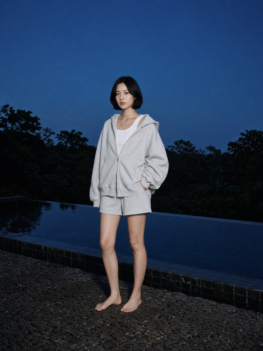 Woman wearing the Women's Heavyweight Full Zip Boxy Hoodie in Flower Gray, full-length model photo