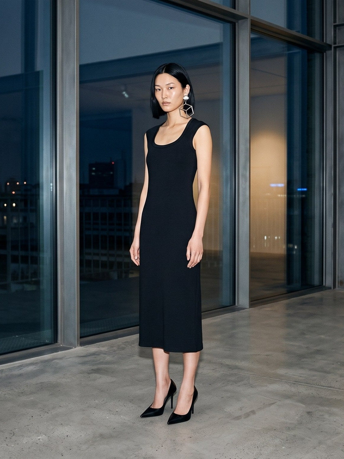 Woman wearing the Women's Slim Sleeveless Dress in Black, full-length model photo
