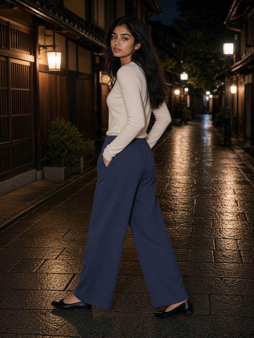 Woman wearing the Women's Wide Leg Sweatpants in Navy Blue, full-length model photo