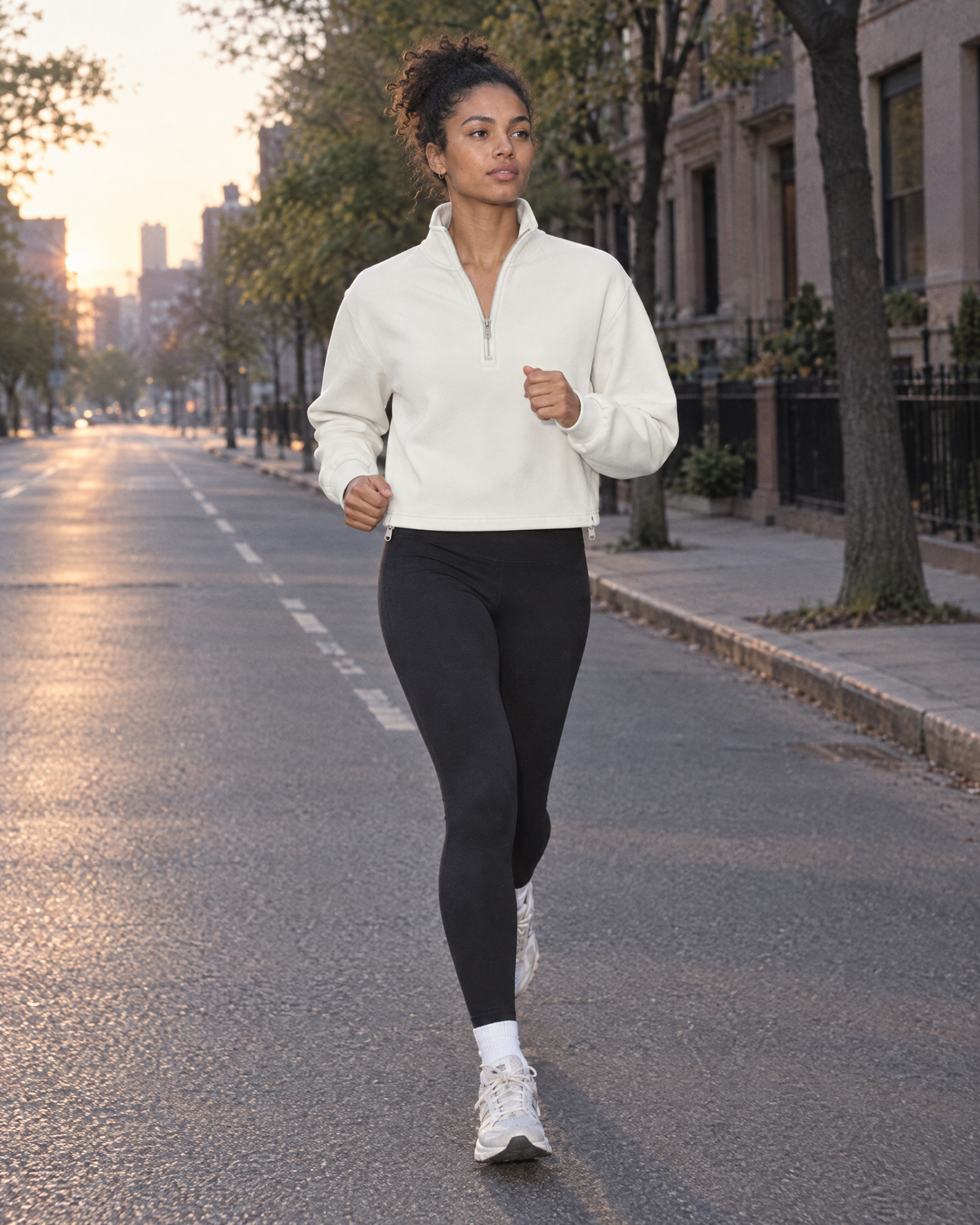 Woman in the Women’s Mock-Neck Quarter-Zip Sweatshirt in White