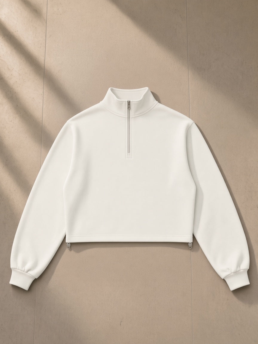Women’s Mock-Neck Quarter-Zip Sweatshirt in White, laid flat on pale limestone, front view