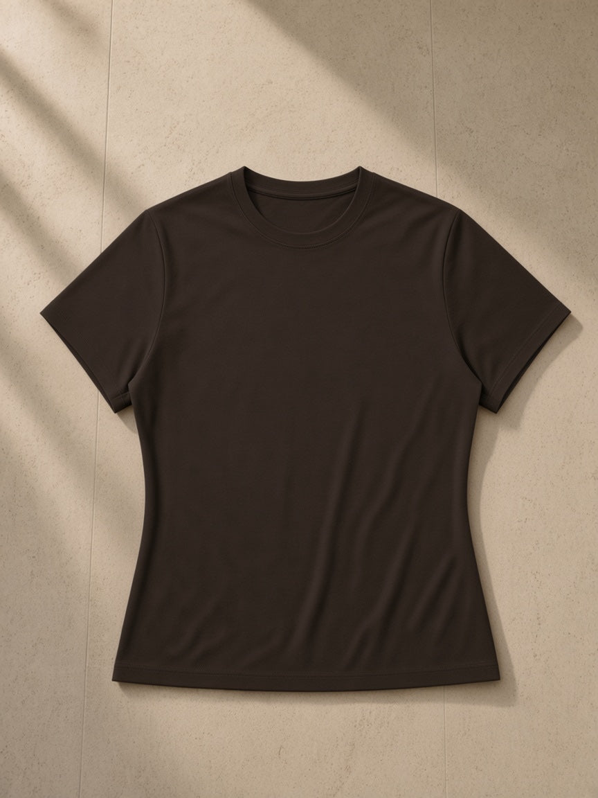 Women’s Slim Fit Performance T-Shirt in Coffee, laid flat on pale limestone, front view