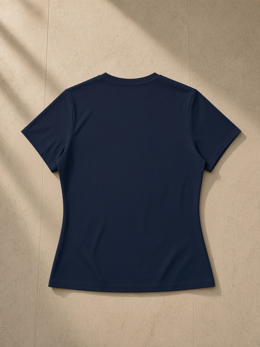 Women’s Slim Fit Performance T-Shirt in Navy Blue, laid flat on pale limestone, back view