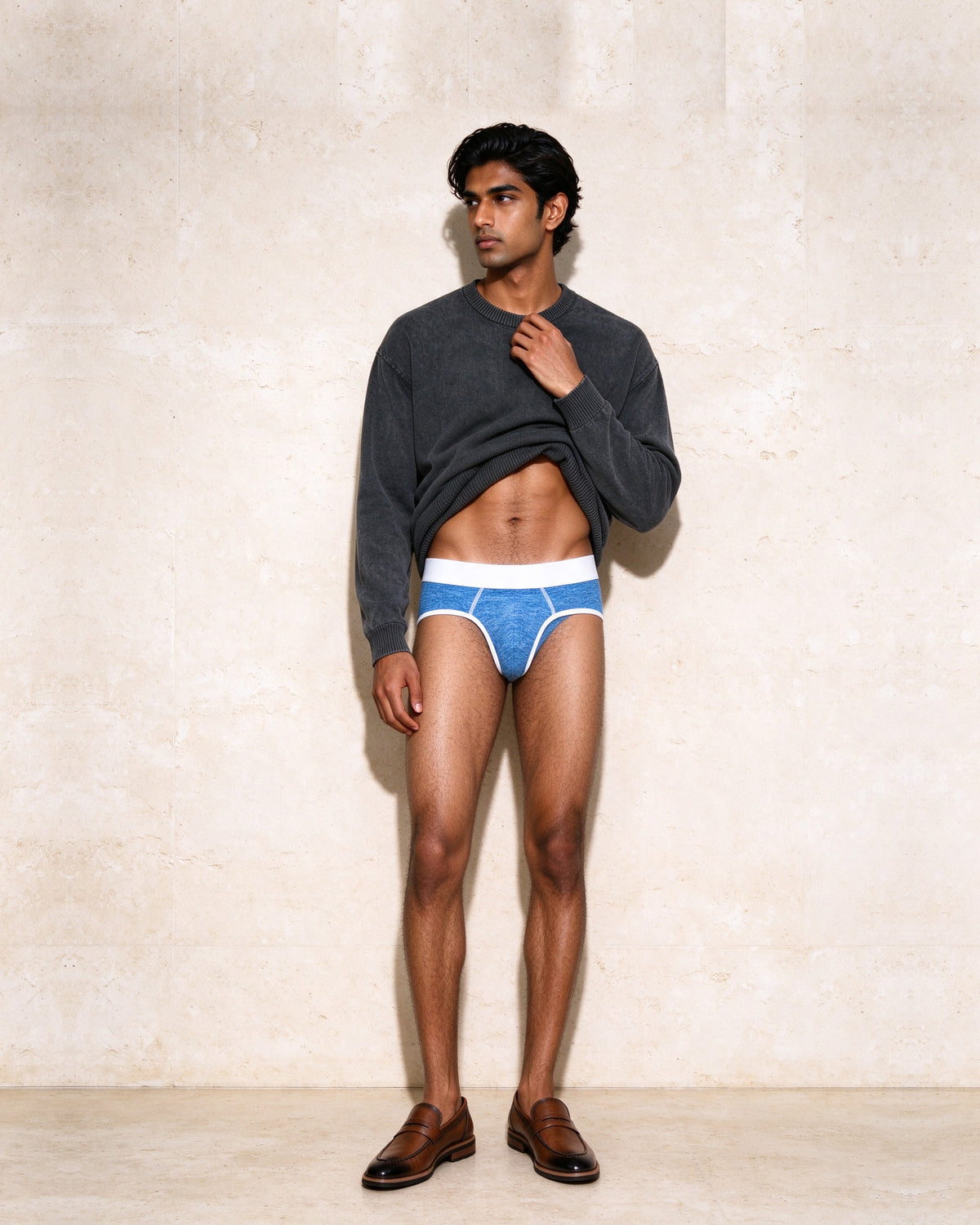 Marcel Afters Mineral Wash Oversized Sweater in black, worn open with the True Notions Brief in Azure and White and The Long Lunch Loafer