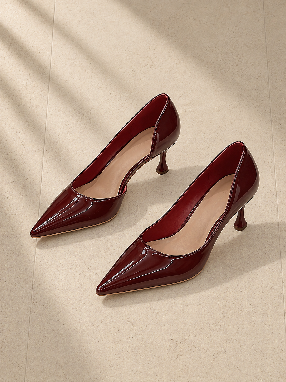 Burgundy pointed pumps, alternate studio pair view