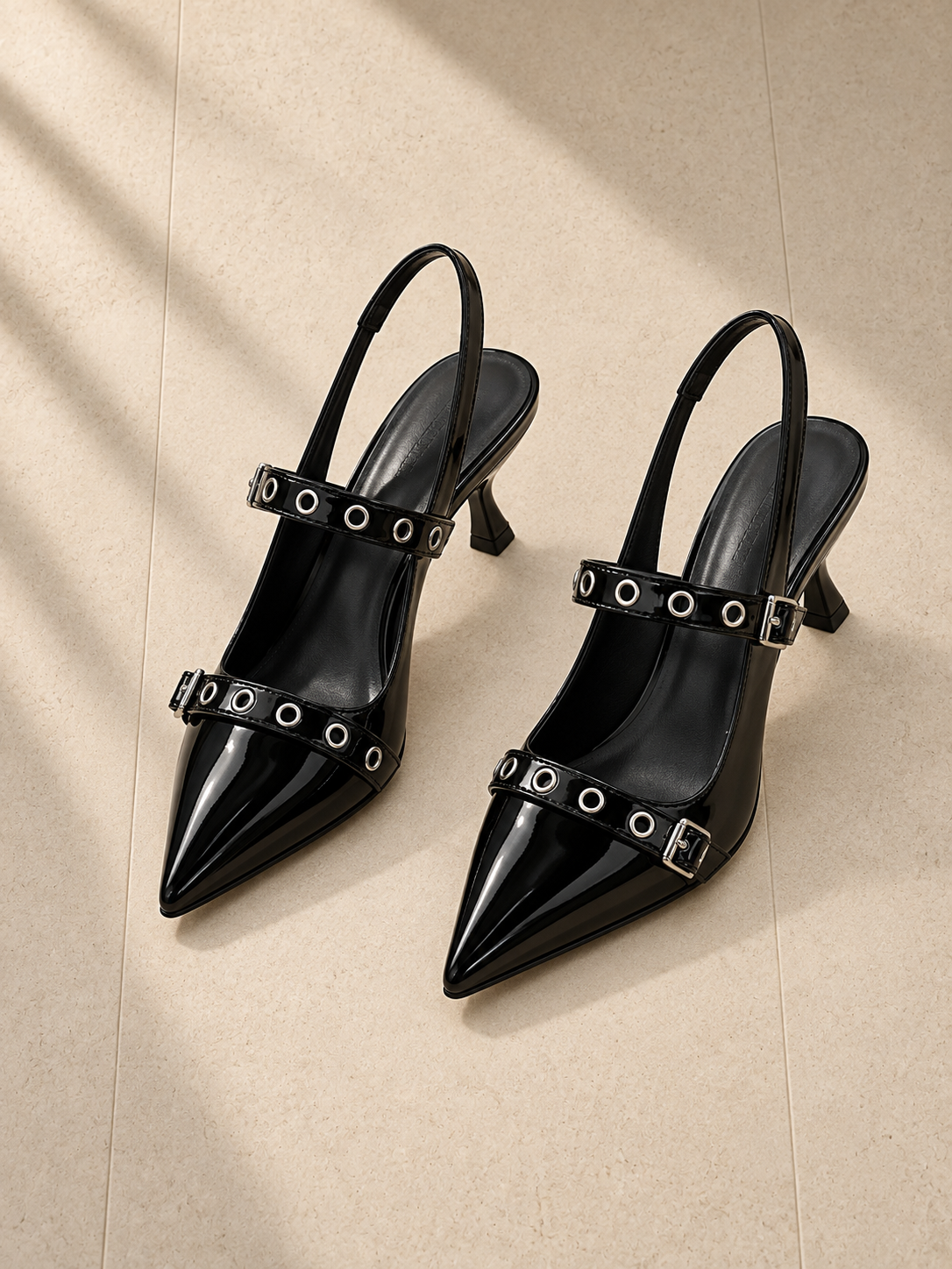 Black patent pointed slingbacks with two eyelet straps