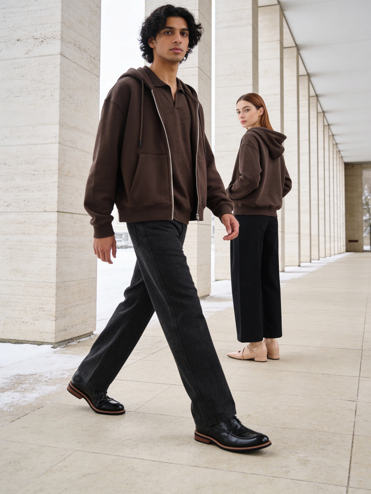 The Concierge Derby worn on model in a limestone enfilade, Tallinn