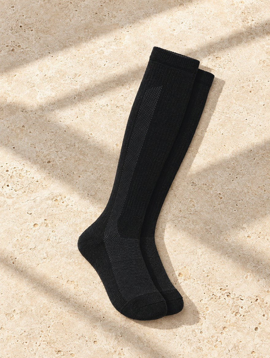 Alpaca Compression Socks in Black — flat lay