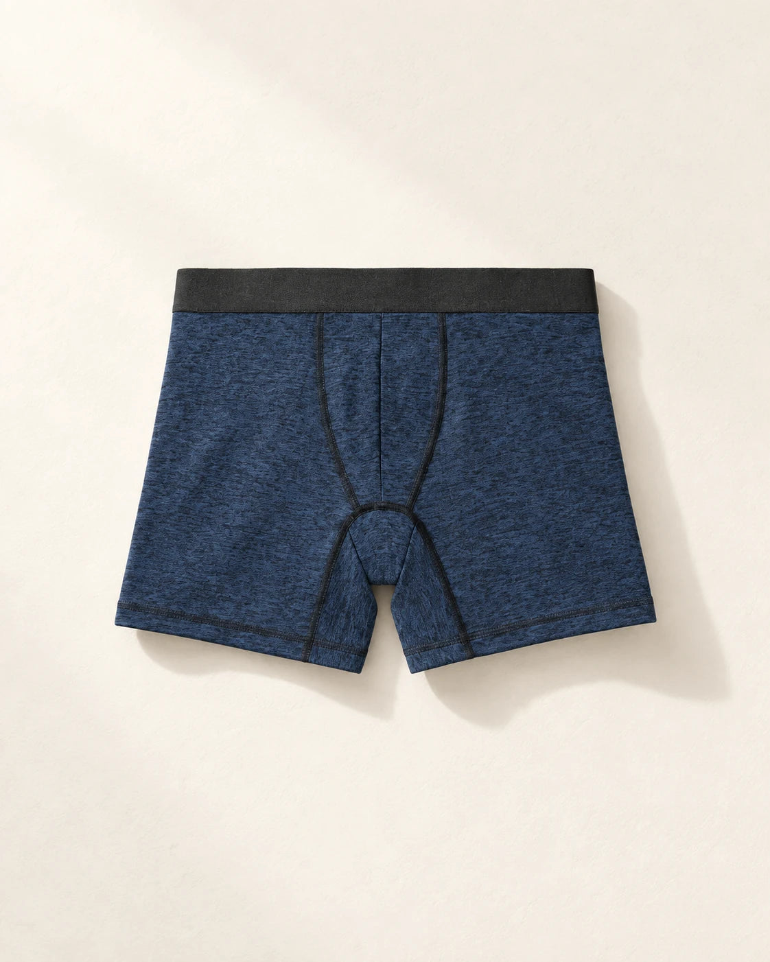True Notions Boxer Brief - Navy / Black, laid flat on limestone