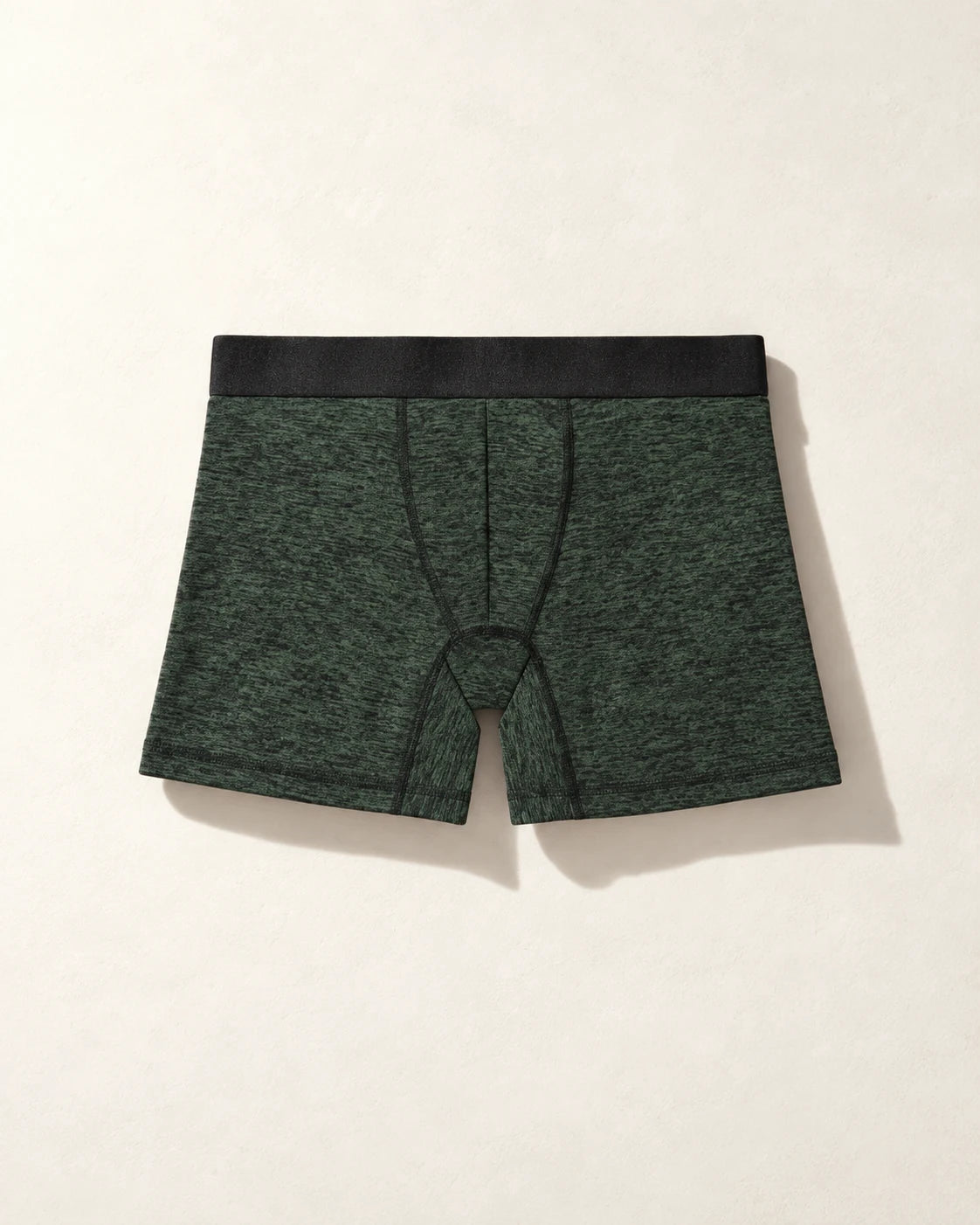 True Notions Boxer Brief - Olive / Black, laid flat on limestone