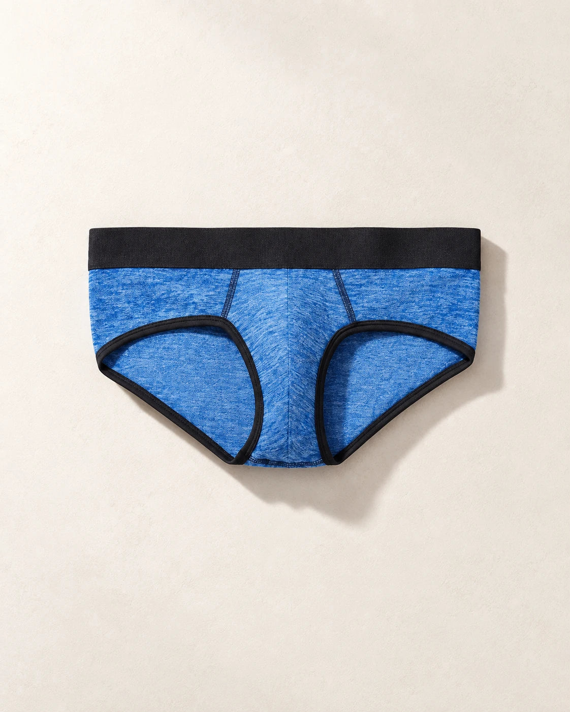 True Notions Brief - Azure / Black, laid flat on limestone