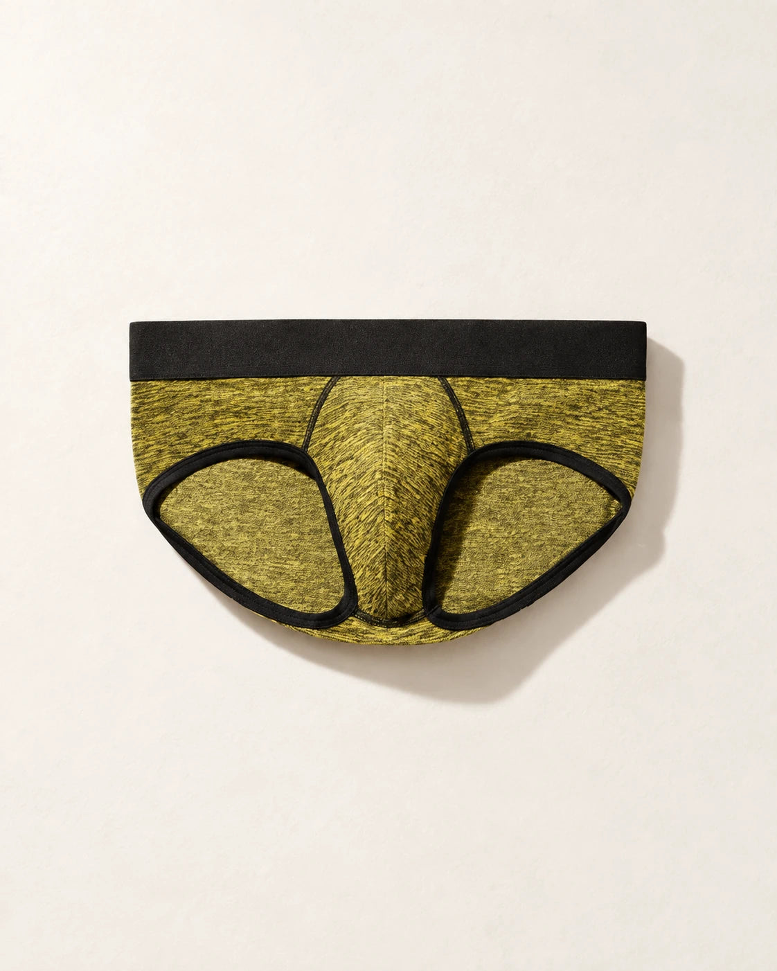 True Notions Brief - Canary / Black, laid flat on limestone