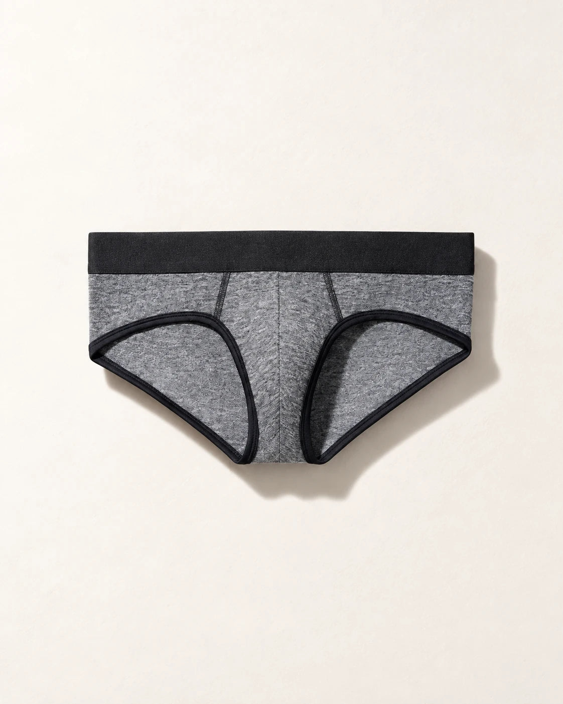 True Notions Brief - Granite / Black, laid flat on limestone