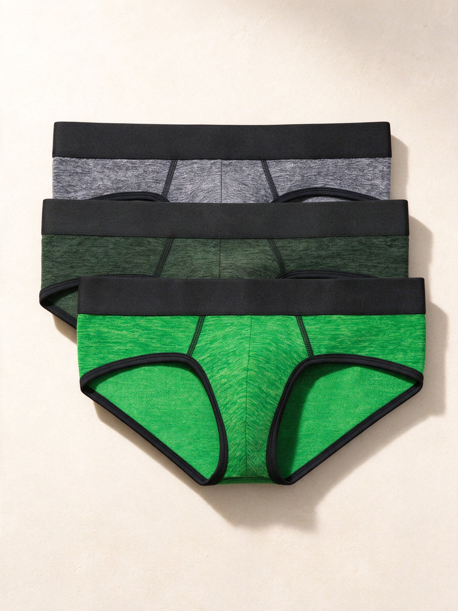 True Notions Briefs 3-Pack - Green / Black, laid flat on limestone