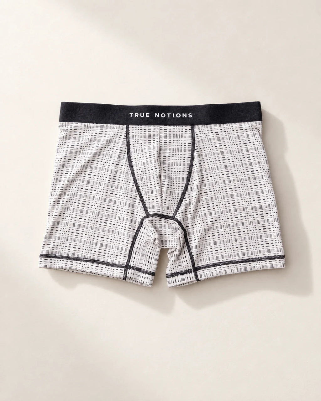 True Notions Tartan Boxer Brief - Ivory, laid flat on limestone