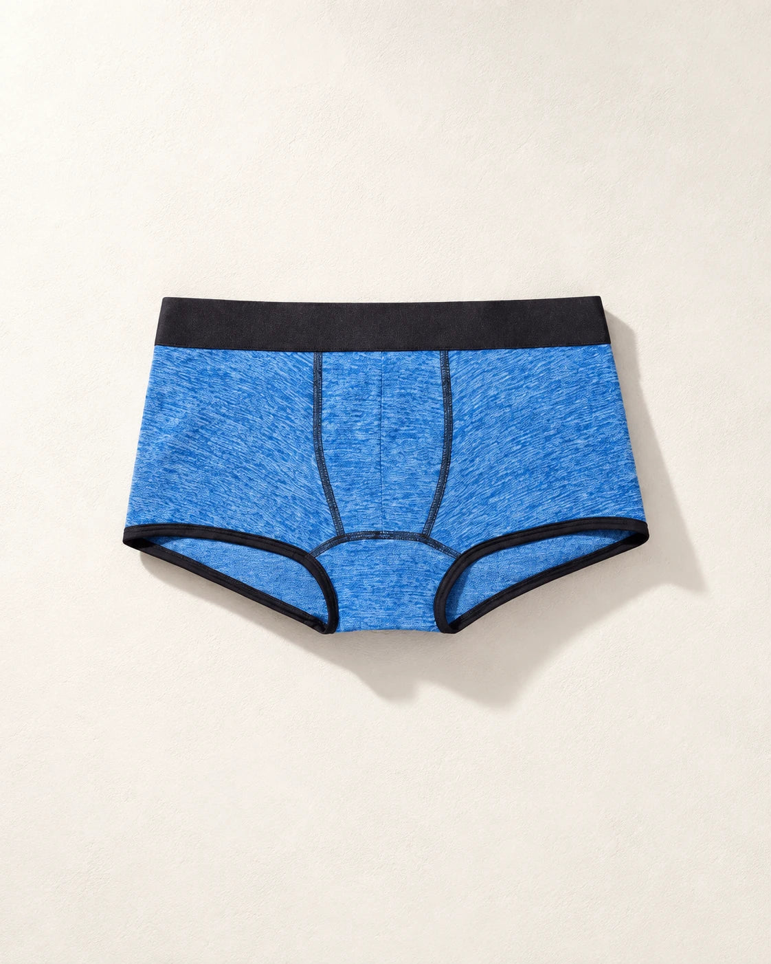 True Notions Trunk - Azure / Black, laid flat on limestone