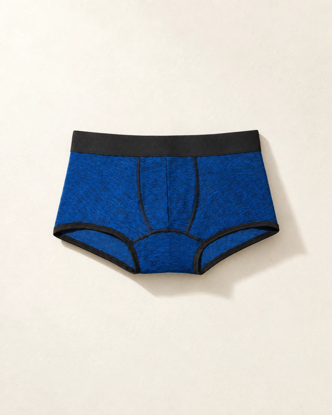 True Notions Trunk - Sapphire / Black, laid flat on limestone