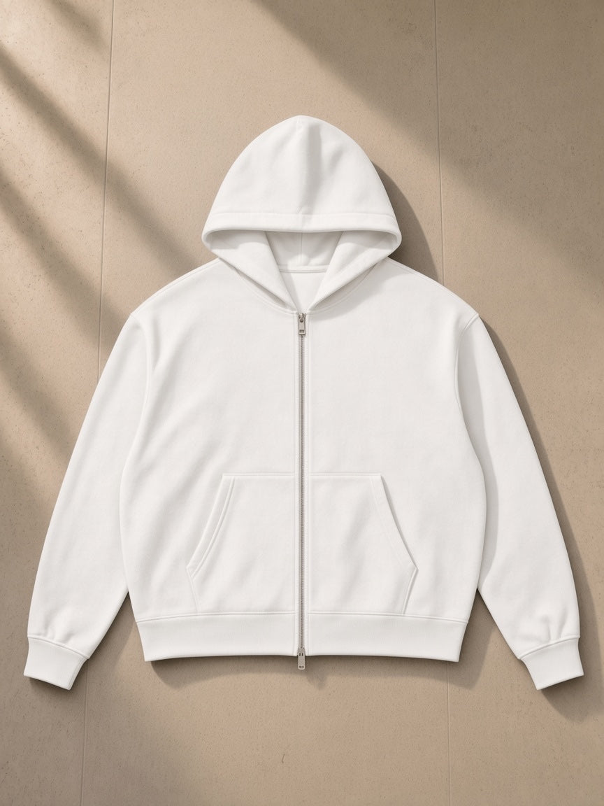 Men's Heavyweight Full Zip Hoodie in White, laid flat on pale limestone, front view