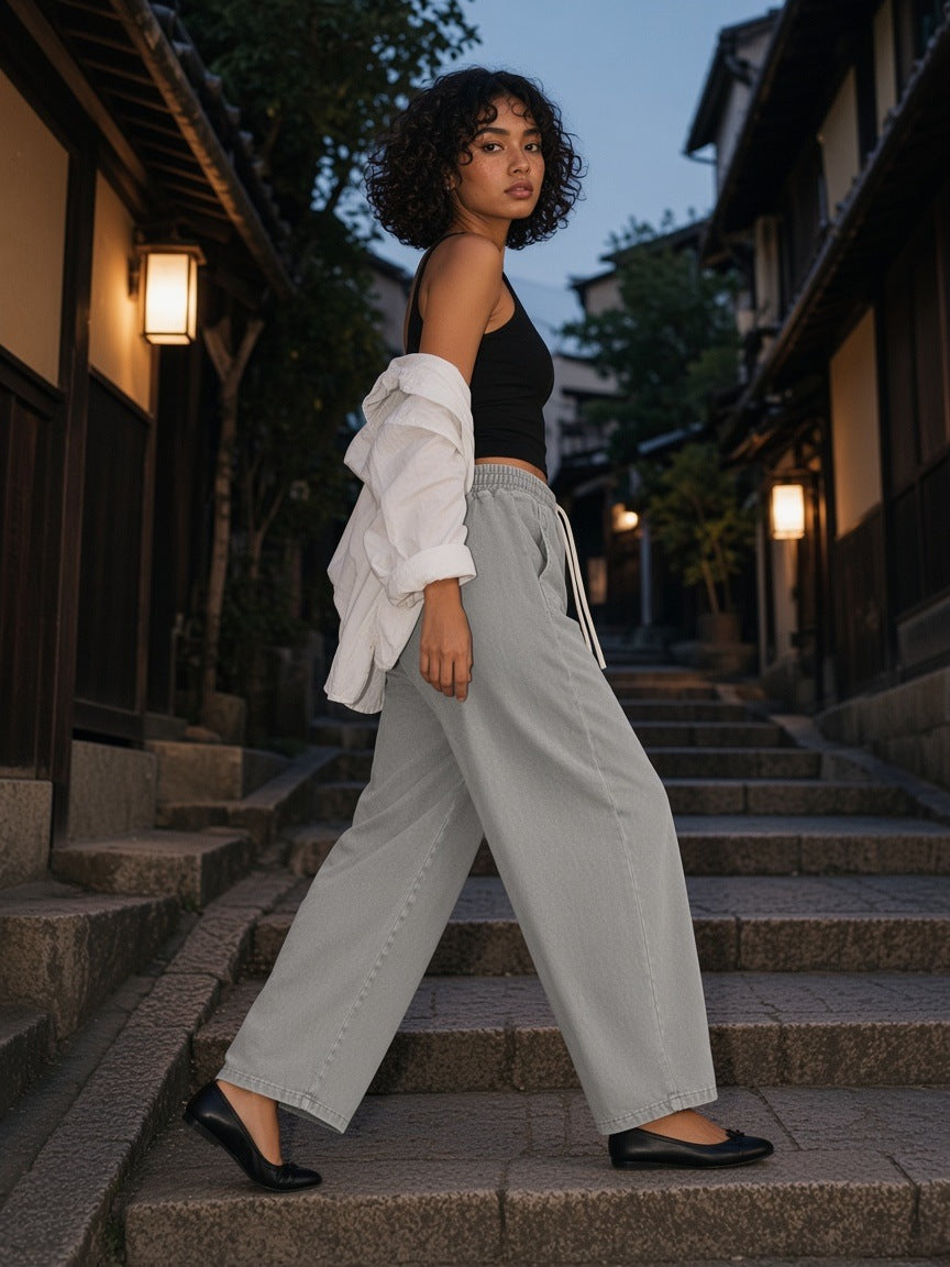 Woman in the Mineral Wash Barrel Leg Pants in Gray in a temple moss garden in Kyoto at blue hour