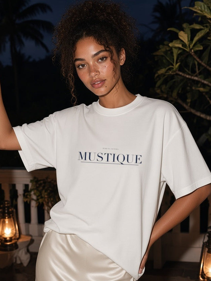 Mustique print close-up on the White tee